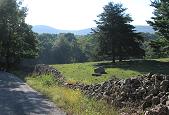 Stone fence alongside the Gooney Manor Loop, with Mount Marshall and Gravel Springs Gap in the distance