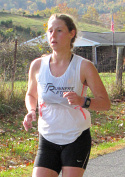 Women's course record holder Candace DeLong finishing the 2015 Greasy-Gooney 10K