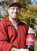 Race director Patrick Farris with a bottle of Dr. Thunder soda